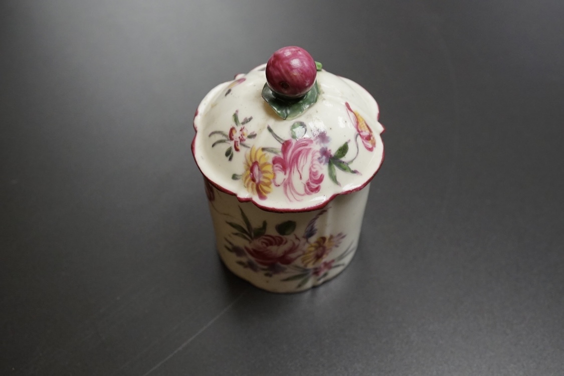 A Mennecy polychrome pomade pot and cover, c.1760, 7.5cm high